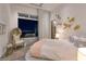 Bright, inviting bedroom with balcony access and city views, featuring a unique accent wall at 621 Majestic Rim Dr, Henderson, NV 89012
