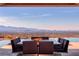 Outdoor dining area with scenic city and mountain views, perfect for entertaining and enjoying the scenery at 621 Majestic Rim Dr, Henderson, NV 89012