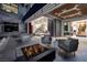 Inviting patio with modern outdoor seating around a cozy fire pit, perfect for entertaining at 621 Majestic Rim Dr, Henderson, NV 89012