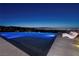 Modern infinity pool and lounge chairs showcasing breathtaking city views at 621 Majestic Rim Dr, Henderson, NV 89012