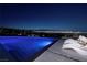 Modern infinity pool and lounge chairs showcasing breathtaking city views at 621 Majestic Rim Dr, Henderson, NV 89012