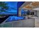 Inviting outdoor living space featuring a pool with stunning city views and modern lounge furniture at 621 Majestic Rim Dr, Henderson, NV 89012