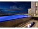 Stunning infinity pool with integrated fire feature and city views at 621 Majestic Rim Dr, Henderson, NV 89012