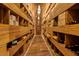 Spacious wine cellar with wooden racks and elegant lighting, perfect for wine enthusiasts at 621 Majestic Rim Dr, Henderson, NV 89012