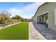 Backyard featuring a lawn, patio, and mature trees at 6270 Lamont Hills Ave, Las Vegas, NV 89139