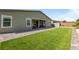 Backyard features a manicured lawn, patio, and storage shed at 6270 Lamont Hills Ave, Las Vegas, NV 89139