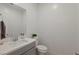 Modern half bathroom with a sleek vanity, mirror, and fixtures at 6270 Lamont Hills Ave, Las Vegas, NV 89139