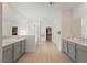 Spacious bathroom with dual vanities, a separate shower, a soaking tub, and direct access to a walk-in closet at 6270 Lamont Hills Ave, Las Vegas, NV 89139
