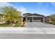 Charming single-story home with a spacious two-car garage and a beautifully landscaped front yard in a residential neighborhood at 6270 Lamont Hills Ave, Las Vegas, NV 89139