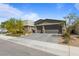 Charming single-story home with a spacious two-car garage and a beautifully landscaped front yard in a residential neighborhood at 6270 Lamont Hills Ave, Las Vegas, NV 89139