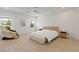 Cozy bedroom boasts wood floors, natural light, and modern decor, plus a convenient massage chair for relaxation at 6270 Lamont Hills Ave, Las Vegas, NV 89139