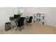 Bright office with large windows, hardwood floors, and comfortable black leather office chairs at 6270 Lamont Hills Ave, Las Vegas, NV 89139