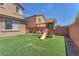 Lovely backyard features a synthetic lawn and a fun playset, ideal for and outdoor activities at 6379 Dundock Ave, Las Vegas, NV 89122