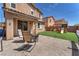 Inviting backyard with a patio, synthetic lawn, and a charming playset, perfect for outdoor fun at 6379 Dundock Ave, Las Vegas, NV 89122