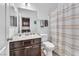 Cozy bathroom featuring a shower with a striped curtain and a single sink vanity at 6379 Dundock Ave, Las Vegas, NV 89122
