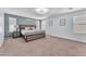 Relaxing bedroom showcasing ample space, natural light, and neutral tones for serene comfort at 6379 Dundock Ave, Las Vegas, NV 89122