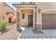 Inviting front entrance with stone accents, covered porch, and a convenient Nest security system at 6379 Dundock Ave, Las Vegas, NV 89122