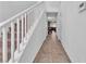 Bright hallway with staircase leading to a spacious living area, creating an open and airy atmosphere at 6379 Dundock Ave, Las Vegas, NV 89122