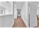 Second floor hallway with carpet flooring and white walls leading to bedrooms at 6379 Dundock Ave, Las Vegas, NV 89122