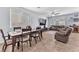 Comfortable living area with dining space, lots of light, and neutral decor, perfect for Gathering gatherings at 6379 Dundock Ave, Las Vegas, NV 89122