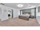 Spacious main bedroom boasting great natural light, a stylish accent wall, and neutral carpeting at 6379 Dundock Ave, Las Vegas, NV 89122