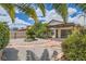 Beautiful backyard featuring desert landscaping, gravel, and a covered patio perfect for relaxation and outdoor enjoyment at 6417 Plumcrest Rd, Las Vegas, NV 89108