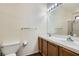 Bright bathroom with a double sink vanity, tile countertop, and a tub with shower combination at 6417 Plumcrest Rd, Las Vegas, NV 89108