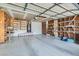 Spacious garage with water heater, shelving and concrete floor, ready for your projects and storage needs at 6417 Plumcrest Rd, Las Vegas, NV 89108