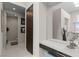Contemporary bathroom with a vanity area, sleek mirror, and a separate toilet room for added privacy at 668 Falcon Summit Ct, Henderson, NV 89012