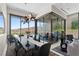 Bright dining room featuring modern light fixture, floor to ceiling windows, and views of the mountains and pool at 668 Falcon Summit Ct, Henderson, NV 89012