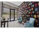 Inviting foyer with bold wallpaper and modern furnishings at 668 Falcon Summit Ct, Henderson, NV 89012