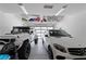 Spacious garage with epoxy flooring and overhead storage racks at 668 Falcon Summit Ct, Henderson, NV 89012
