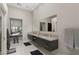 Main bathroom boasts dual sinks, sleek countertops, and modern fixtures with a separate vanity area at 668 Falcon Summit Ct, Henderson, NV 89012