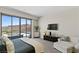 Bright main bedroom featuring mountain views, seating, and neutral tones at 668 Falcon Summit Ct, Henderson, NV 89012