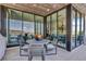 Outdoor patio with a round table and seating, and a beautiful view of the mountains and pool at 668 Falcon Summit Ct, Henderson, NV 89012