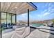 Outdoor patio featuring a built in grill and a beautiful view of the pool and mountains at 668 Falcon Summit Ct, Henderson, NV 89012