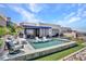 Backyard pool featuring modern outdoor furniture, and a mountain view at 668 Falcon Summit Ct, Henderson, NV 89012