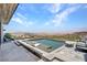 Backyard pool featuring comfortable outdoor furniture, a spa and a mountain view at 668 Falcon Summit Ct, Henderson, NV 89012