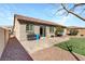 This backyard has a patio, small patch of grass, neutral colors and is ready to entertain at 6814 Willowcroft St, Las Vegas, NV 89149