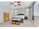 Cozy bedroom featuring large windows, neutral walls, and carpet flooring at 6814 Willowcroft St, Las Vegas, NV 89149