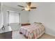 Cozy bedroom with a ceiling fan, natural light, and a small desk, creating a comfortable space at 6814 Willowcroft St, Las Vegas, NV 89149
