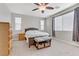 Bright bedroom with carpet, ceiling fan, and natural light from the windows at 6814 Willowcroft St, Las Vegas, NV 89149