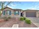 Charming single-story home with desert landscaping, a paver driveway, and a two-car garage at 6814 Willowcroft St, Las Vegas, NV 89149