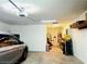Garage with a car, workbench, storage shelves, and overhead lighting at 6814 Willowcroft St, Las Vegas, NV 89149