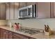 This kitchen features updated appliances, granite countertops, and plenty of cabinet space for storage at 6814 Willowcroft St, Las Vegas, NV 89149