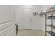 Large laundry room area featuring built-in shelving and tile flooring at 6814 Willowcroft St, Las Vegas, NV 89149