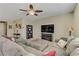 Inviting living room with a plush sectional sofa, modern decor, and a large TV at 6814 Willowcroft St, Las Vegas, NV 89149
