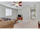 Open living area with comfortable seating and a TV, perfect for relaxing and entertaining at 6814 Willowcroft St, Las Vegas, NV 89149