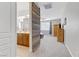 Open main bedroom space with connecting bathroom with a sliding barn door at 6814 Willowcroft St, Las Vegas, NV 89149
