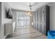 Cozy bedroom with a ceiling fan, built-in wardrobe and sliding door at 6925 Emerald Springs Ln, Las Vegas, NV 89113